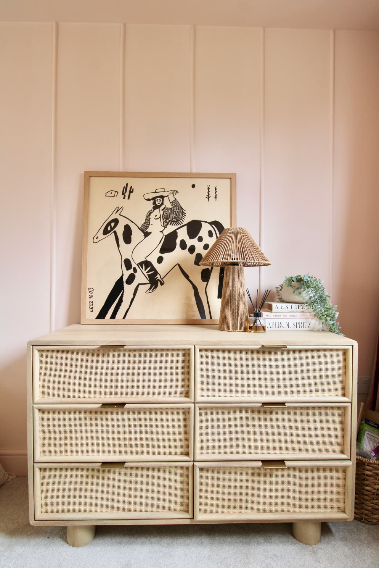 The master bedroom: peach panelled walls, skylight and rattan headboard