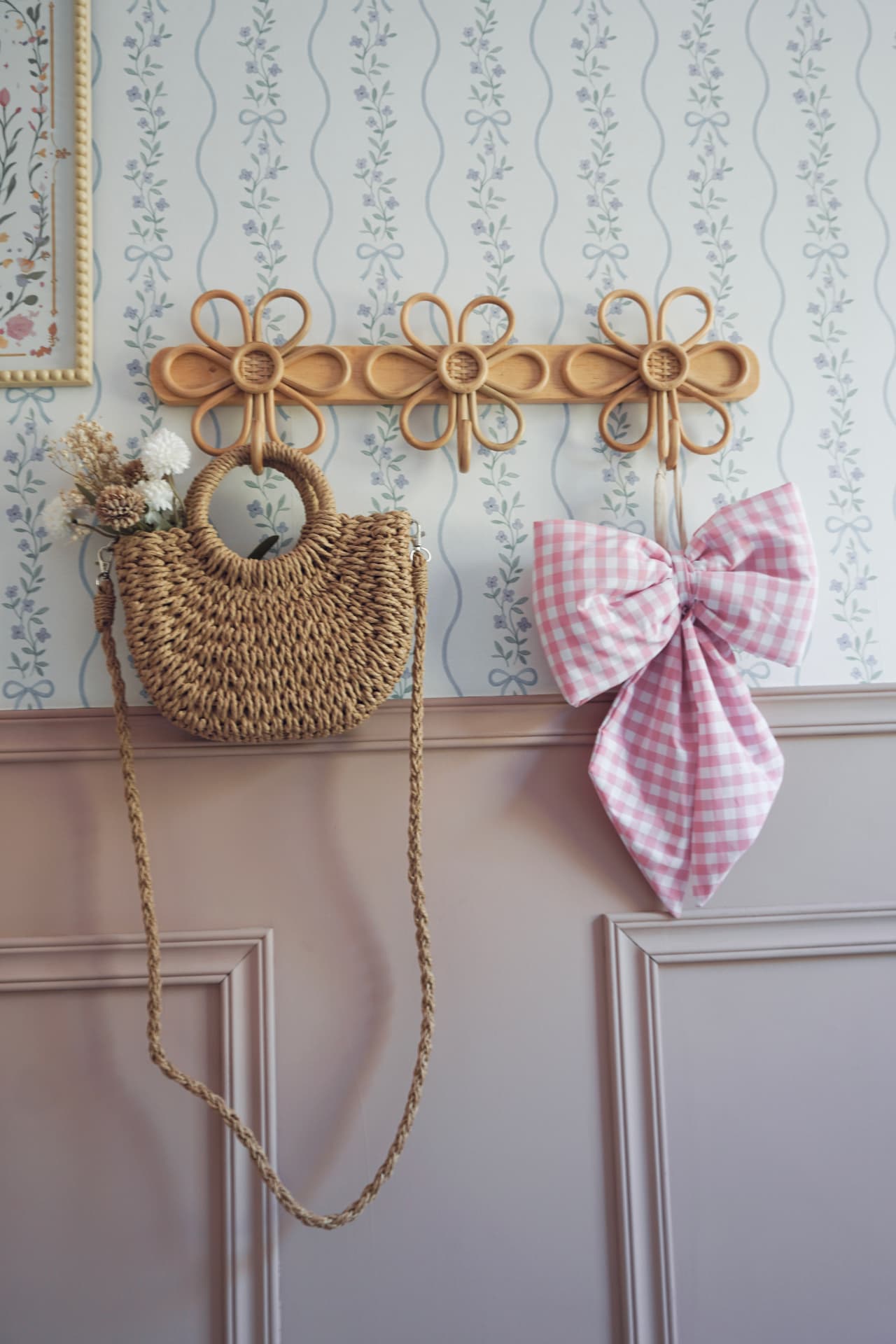 The children's room: gingham daybed, pink panelling and trailing floral wallpaper